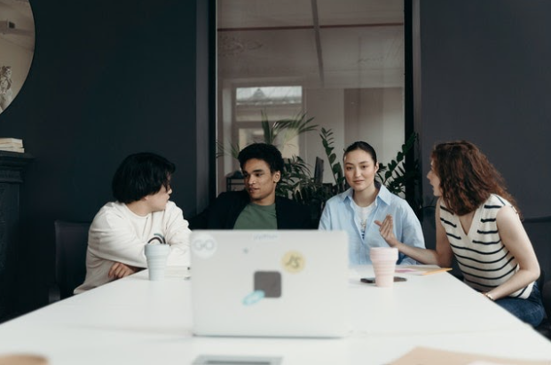 A team of people around a desk