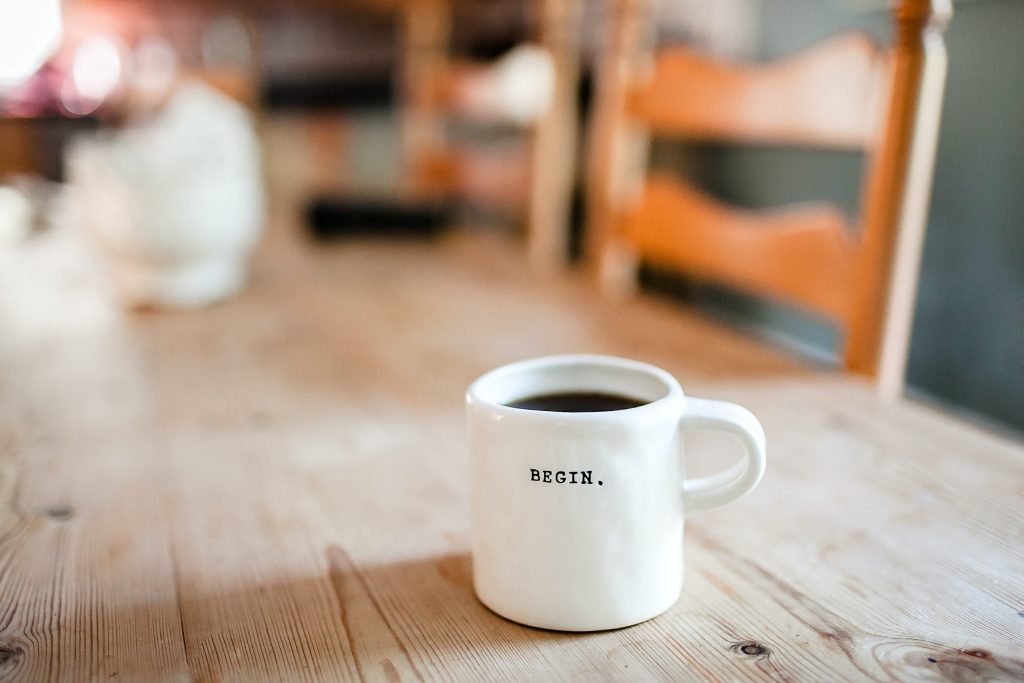 A mug with the word "begin" on it