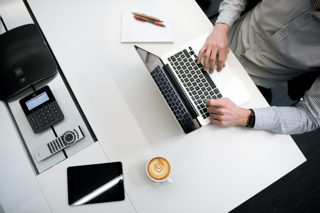 A desk with business items on it